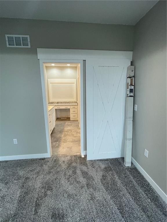 unfurnished bedroom with carpet