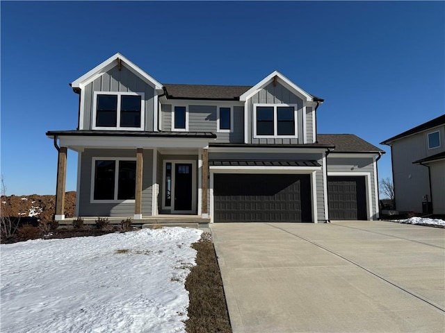 view of front of property featuring a garage and a porch