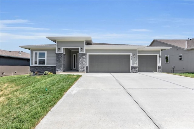 view of front of property with a garage and a front yard