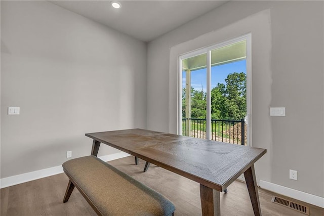 dining room with wood-type flooring