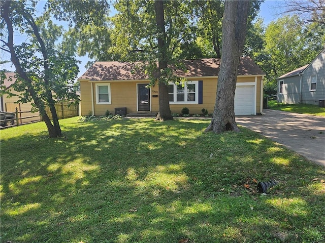 view of front facade with a garage and a front yard