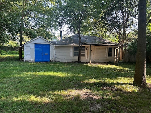 exterior space with a storage shed and a yard