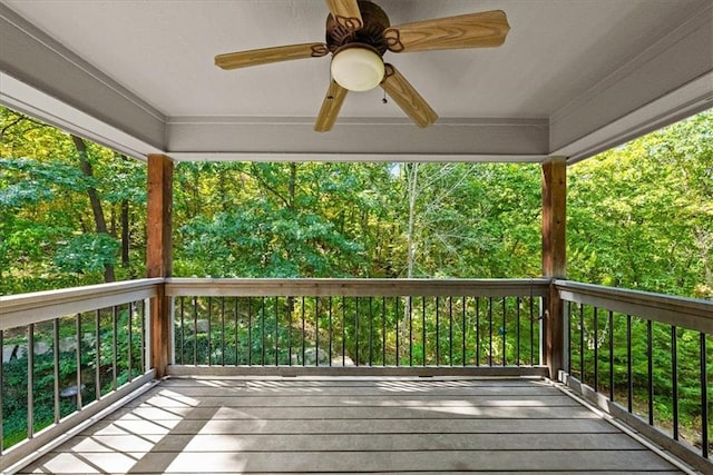 wooden terrace featuring ceiling fan