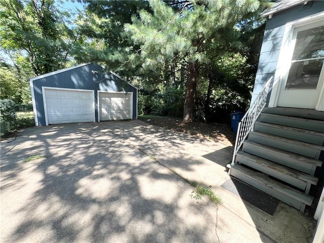 exterior space featuring an outdoor structure and a garage