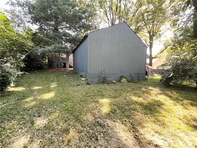 view of outdoor structure with a lawn