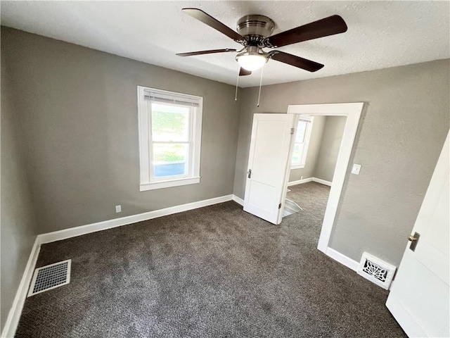 unfurnished bedroom featuring ceiling fan and carpet