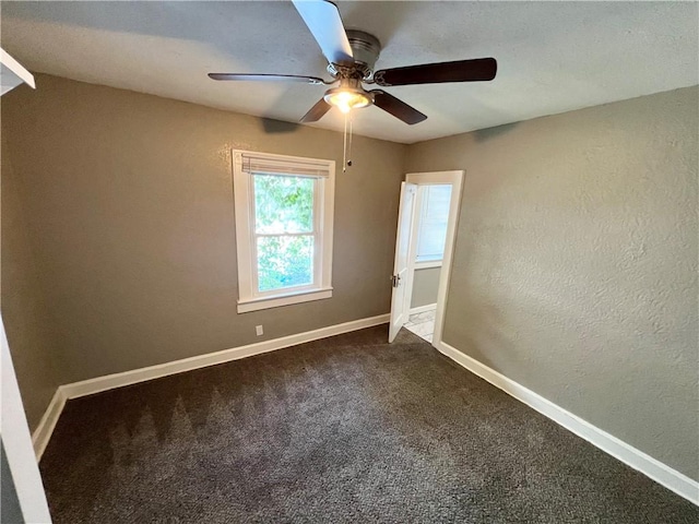 unfurnished bedroom with ceiling fan and carpet