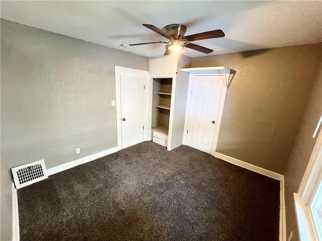 unfurnished bedroom with carpet flooring, ceiling fan, and a closet