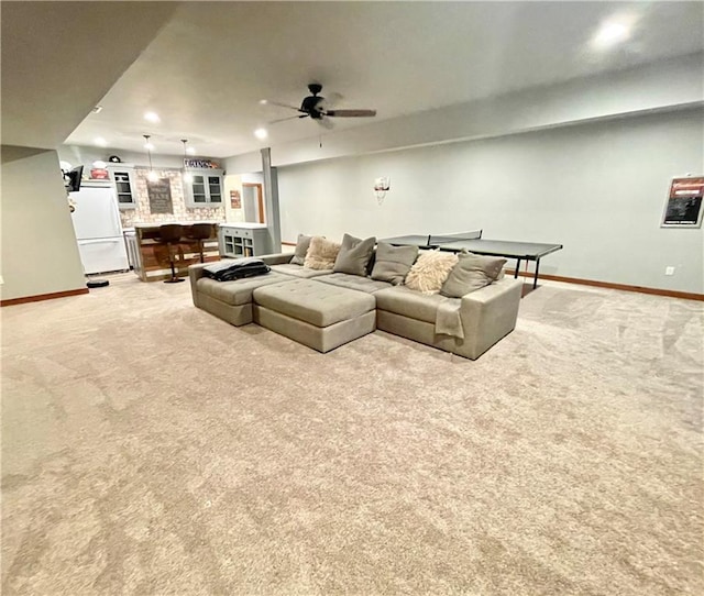 living room with light carpet and ceiling fan