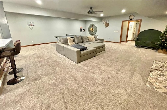 carpeted living room featuring ceiling fan