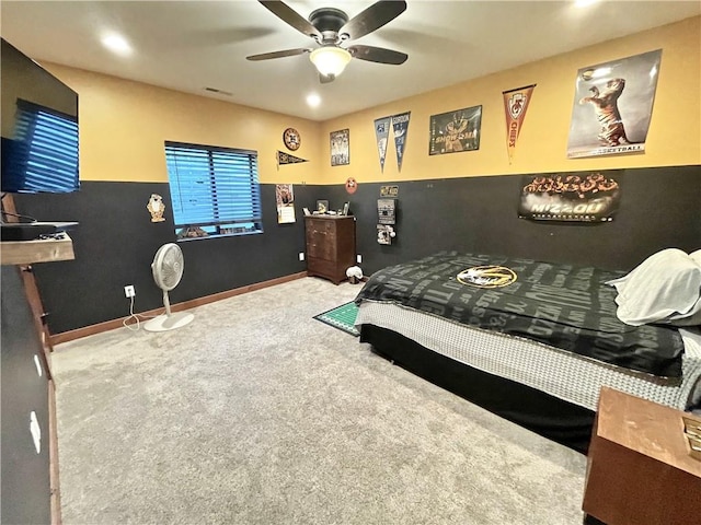 bedroom with ceiling fan and carpet flooring