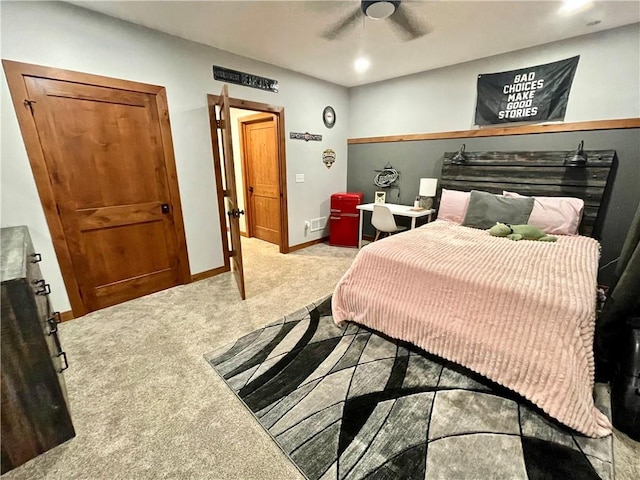 bedroom with ceiling fan and light colored carpet