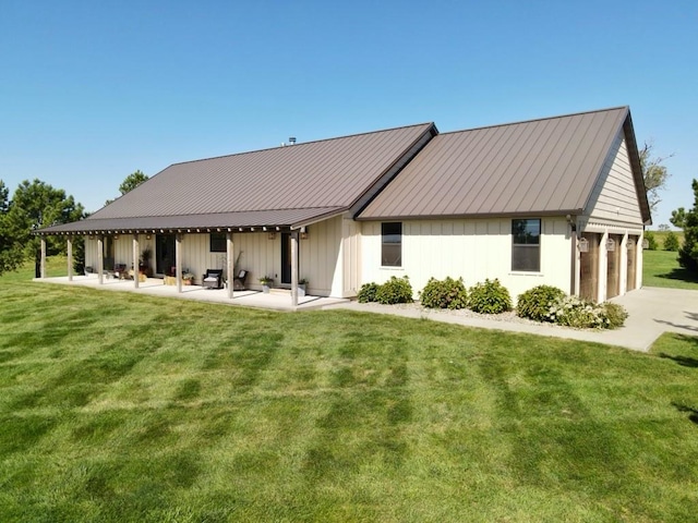 exterior space with a front lawn and a patio