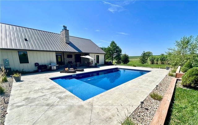 view of swimming pool featuring a patio