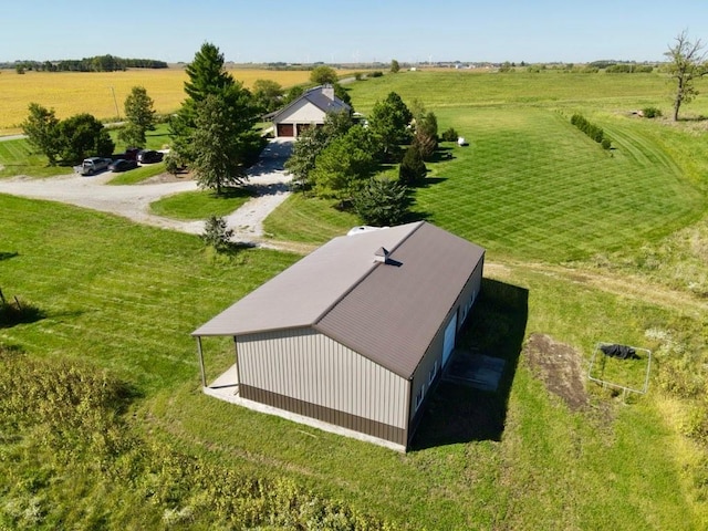 birds eye view of property with a rural view