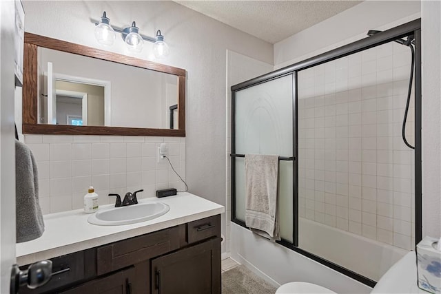 full bathroom featuring vanity, tasteful backsplash, tile walls, toilet, and enclosed tub / shower combo