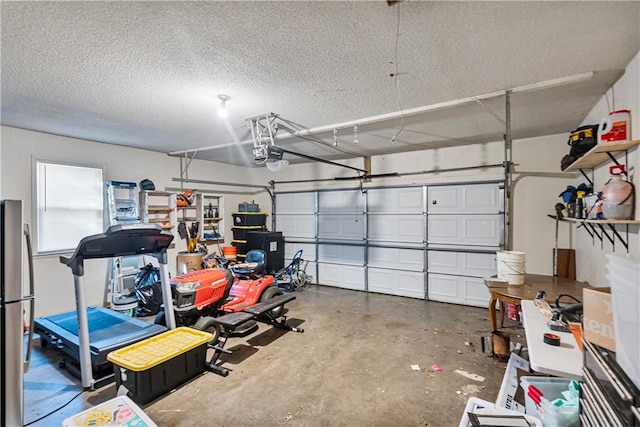 garage featuring stainless steel refrigerator