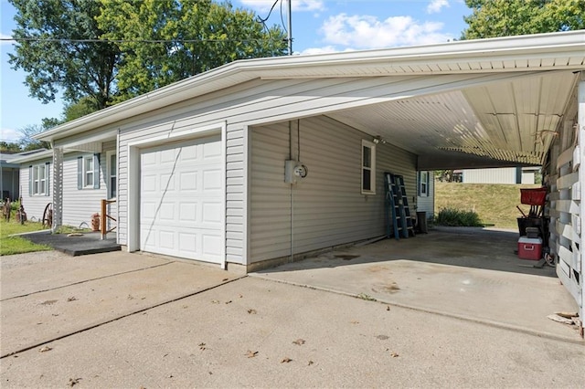 garage with cooling unit and a carport