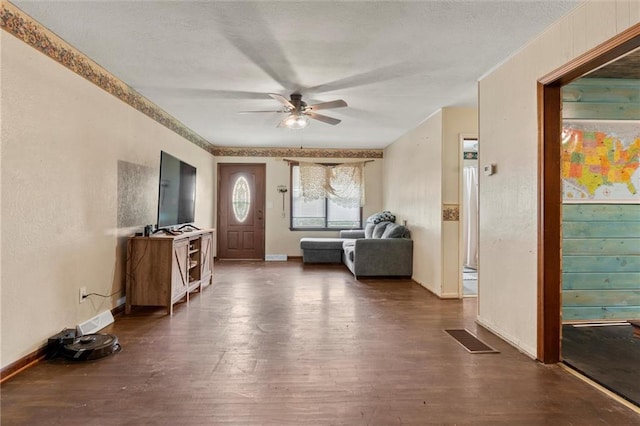 entrance foyer with ceiling fan and dark hardwood / wood-style flooring