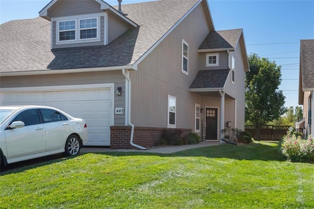 view of front of home with fence, roof with shingles, a front yard, a garage, and brick siding