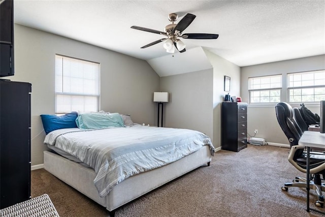 bedroom with lofted ceiling, a ceiling fan, a textured ceiling, carpet flooring, and baseboards