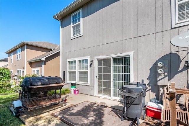 back of property featuring a patio