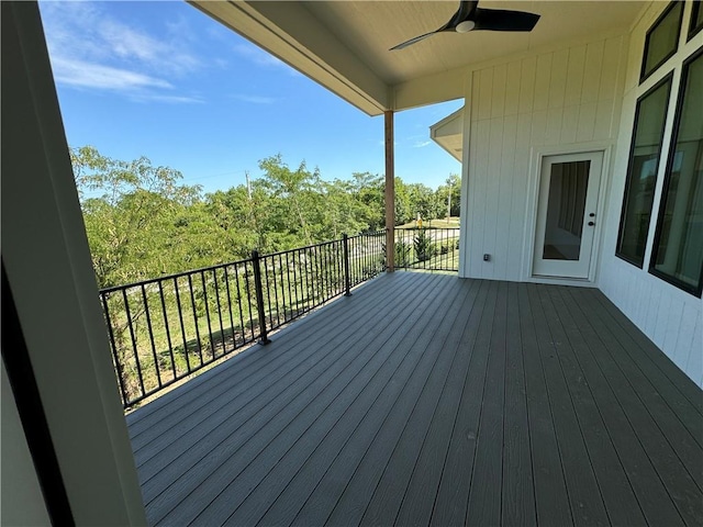 wooden terrace featuring ceiling fan