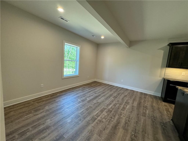 interior space with recessed lighting, visible vents, dark wood-style flooring, and baseboards