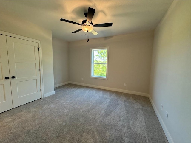 interior space with a ceiling fan and baseboards