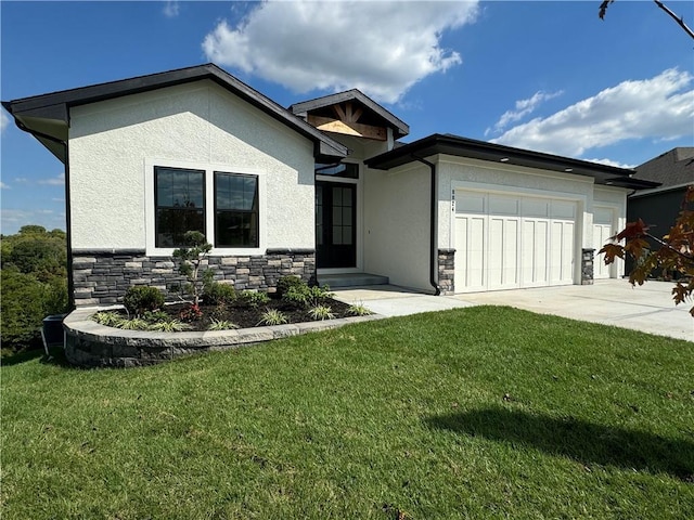 view of front of home with driveway, stone siding, a front yard, stucco siding, and a garage