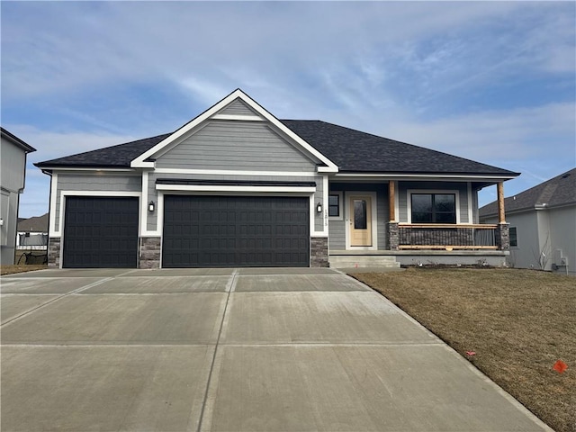 view of front of home featuring a garage and covered porch