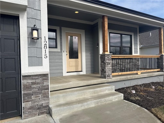 property entrance with covered porch