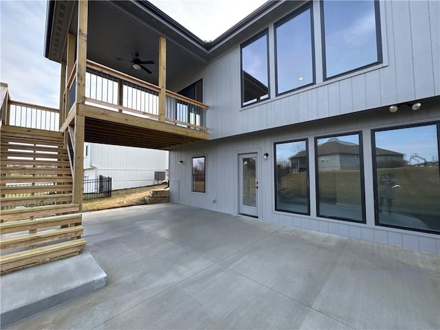 rear view of property featuring central AC unit, a patio, and ceiling fan