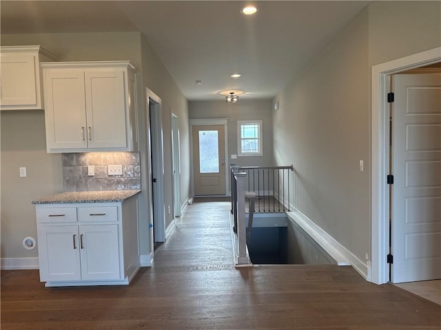 hallway featuring dark wood-type flooring