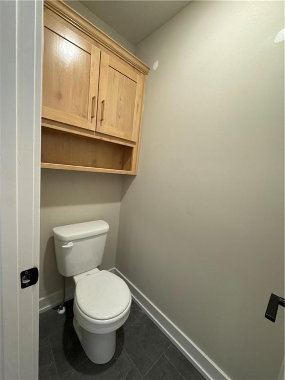 bathroom featuring tile patterned floors and toilet