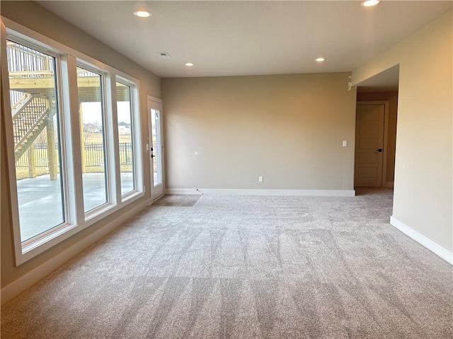 empty room featuring light carpet