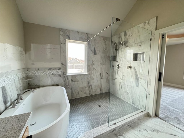 bathroom with vanity, separate shower and tub, tile walls, and lofted ceiling