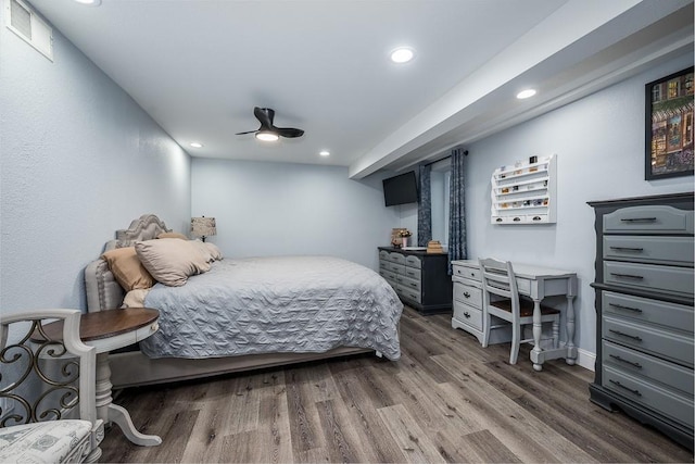 bedroom featuring dark hardwood / wood-style floors and ceiling fan