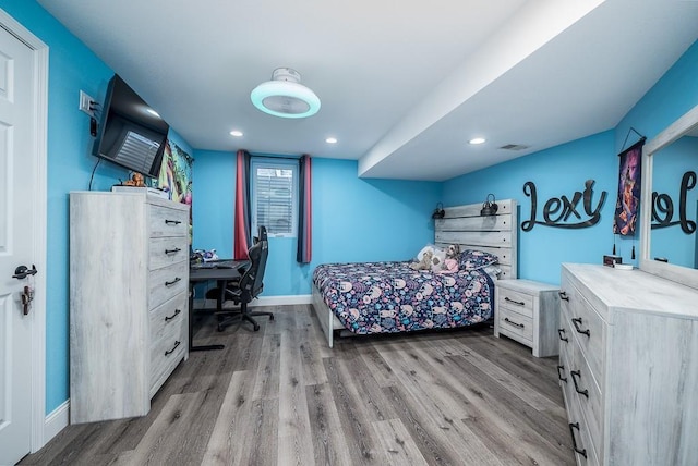 bedroom with light wood-type flooring