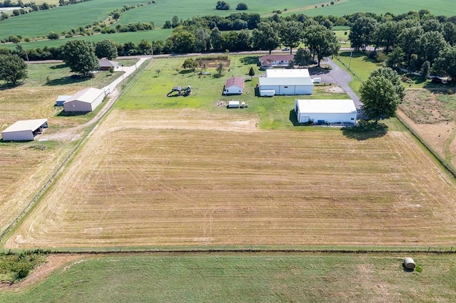 birds eye view of property with a rural view