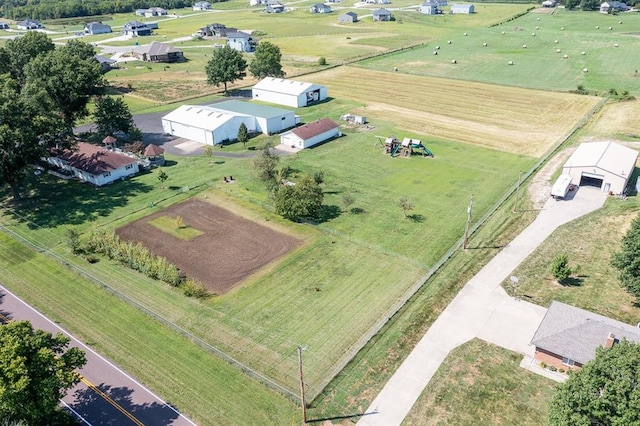 birds eye view of property with a rural view