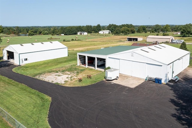 birds eye view of property with a rural view