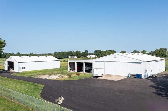 view of outbuilding with a yard