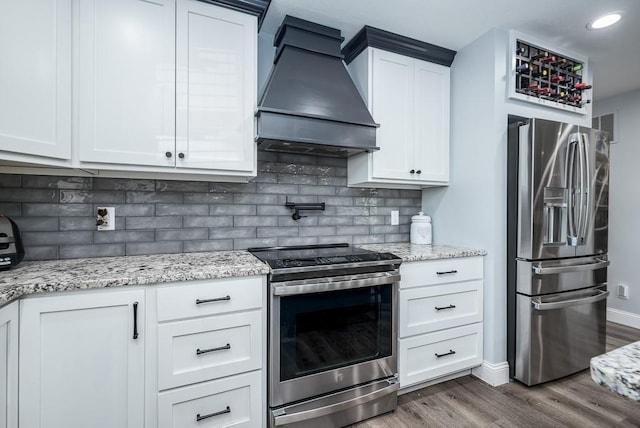 kitchen featuring white cabinetry, stainless steel appliances, custom exhaust hood, dark hardwood / wood-style floors, and decorative backsplash