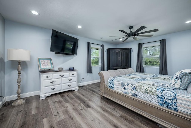 bedroom with ceiling fan and light wood-type flooring