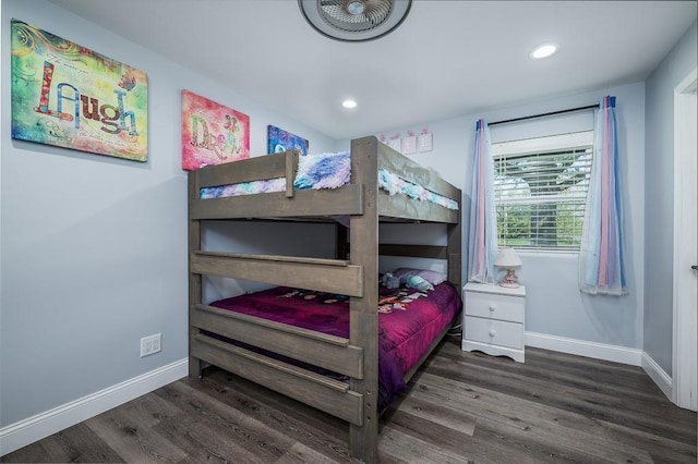 bedroom with dark hardwood / wood-style flooring