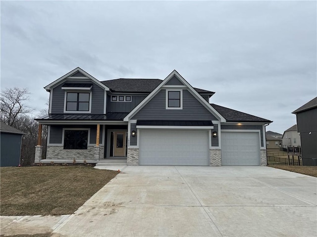 craftsman-style home with a garage and a front yard