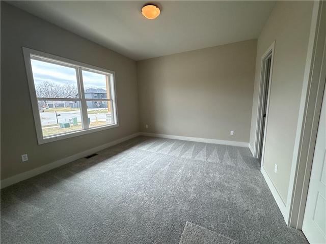 spare room featuring carpet floors