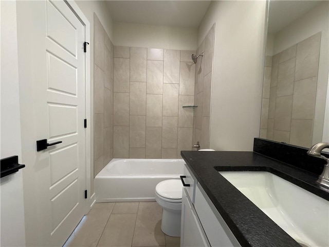 full bathroom featuring tile patterned flooring, vanity, tiled shower / bath combo, and toilet