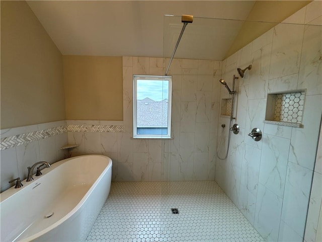 bathroom with tile walls, vaulted ceiling, and separate shower and tub